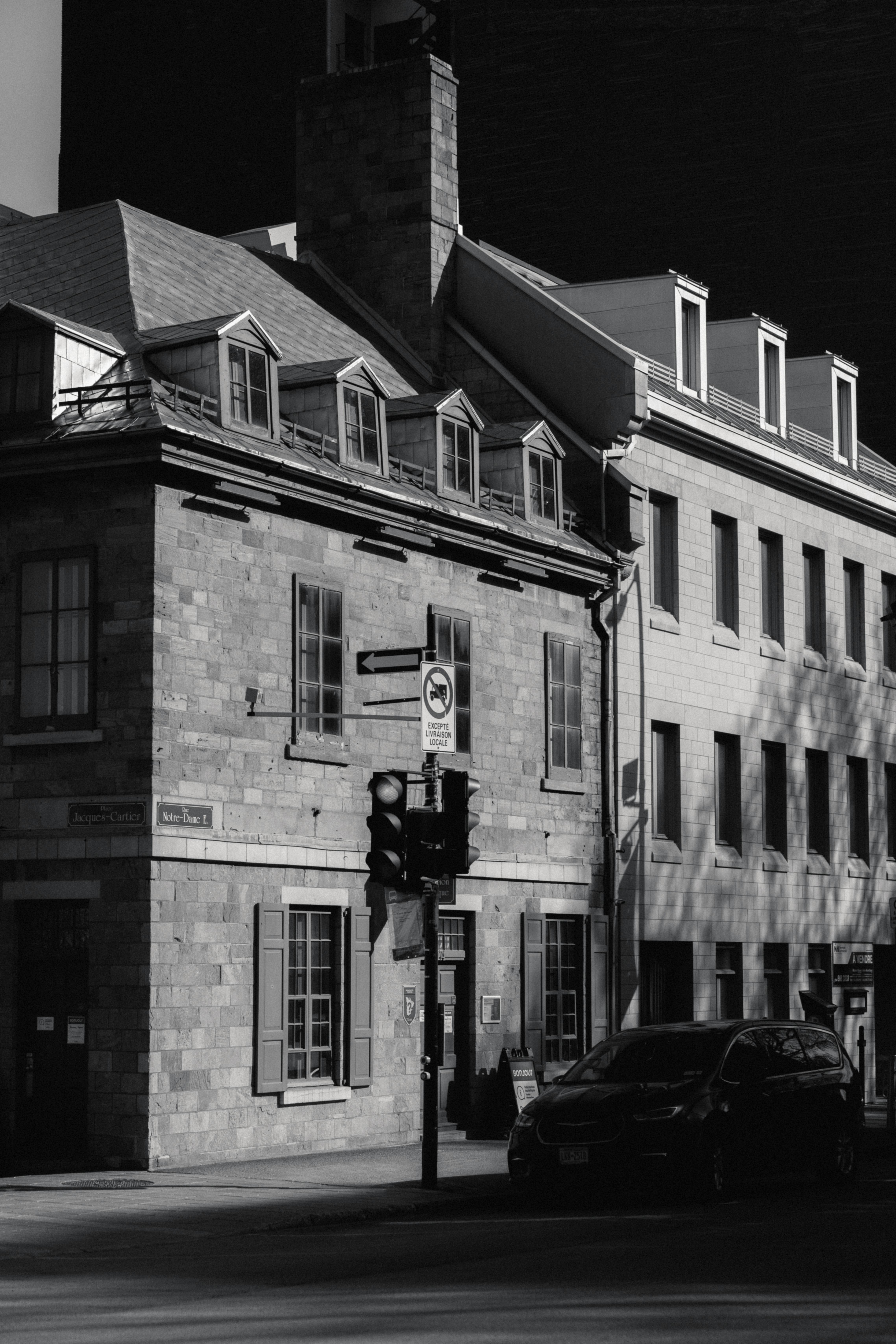 Historic stone buildings with multiple chimneys demonstrating our expertise with older structures