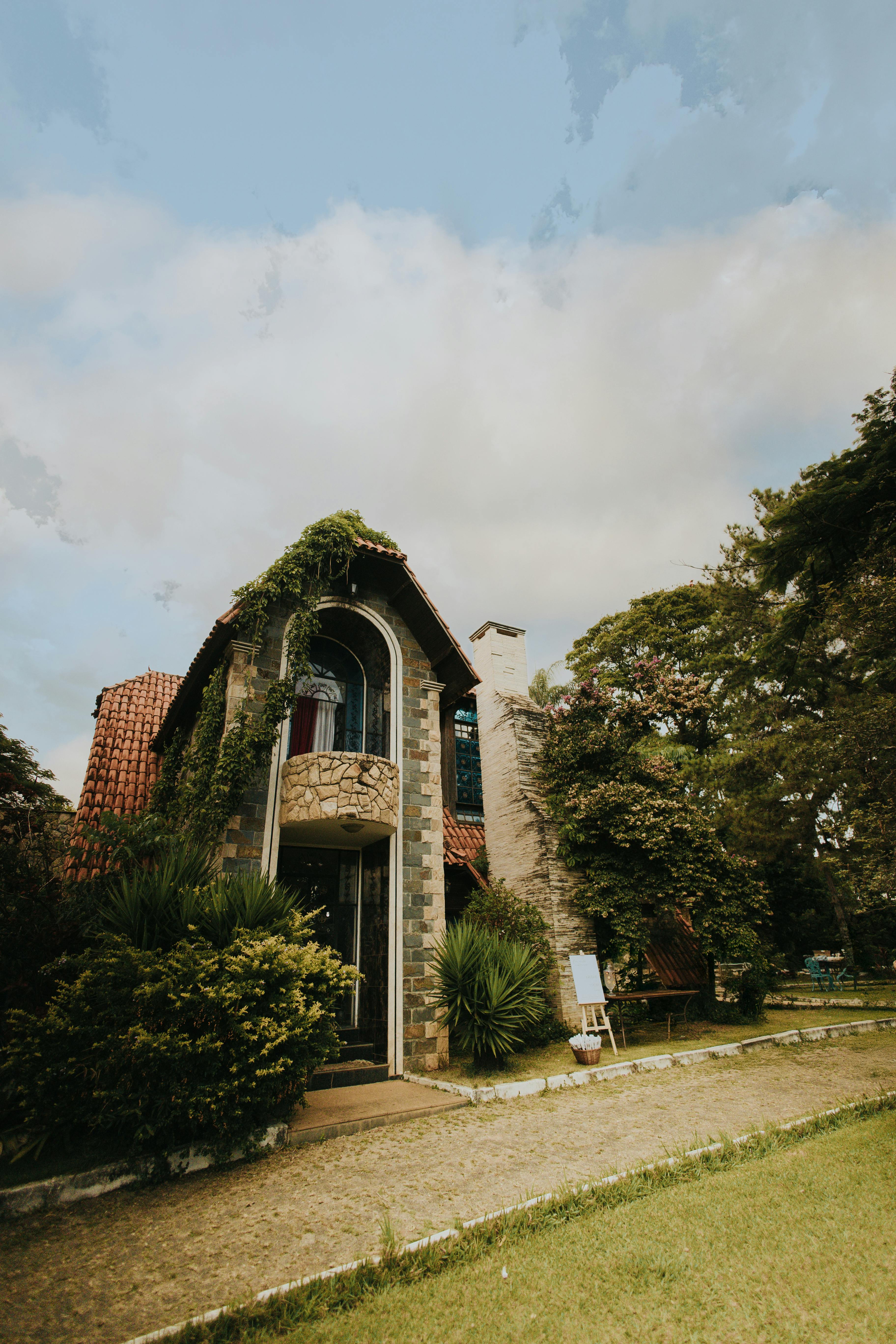 Stone building with arched windows and chimney showing architectural expertise