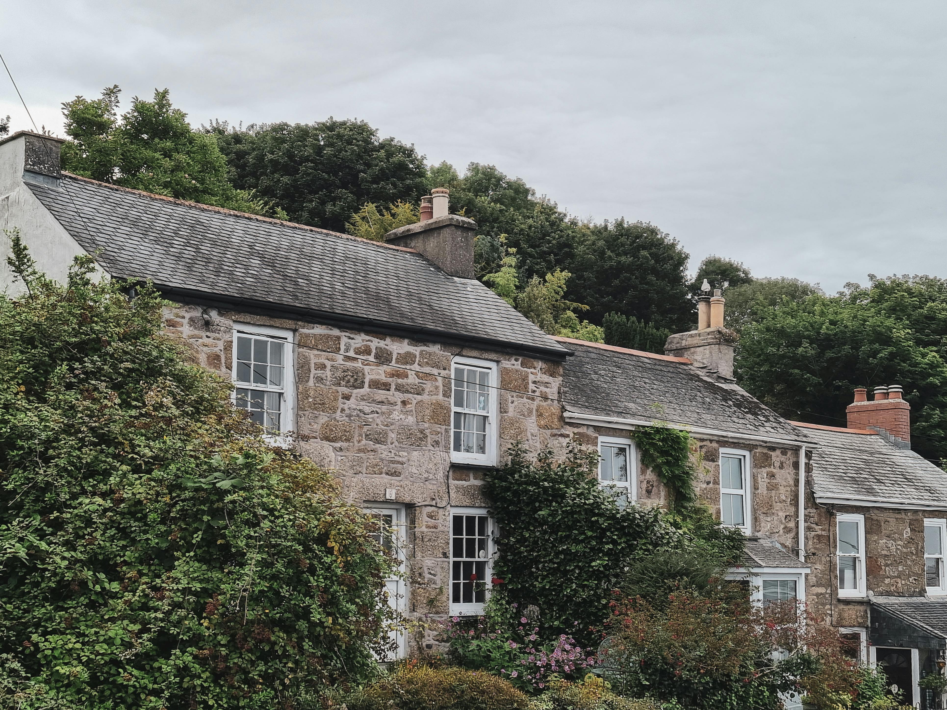 Traditional stone cottage with well-maintained chimney showcasing our quality work